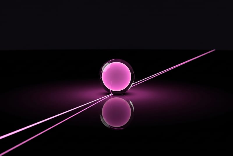 A glass sphere with a calm magenta core; a single course line of light runs through it to the horizon
